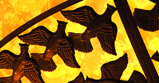 A clos-up view of the grouse that adorn the chandelier